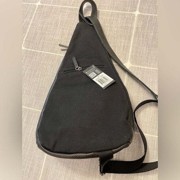 NWOT The Sak Black Leather Sling Backpack - New 5 pocket Leather 1 side canvas. - Picture 4 of 16